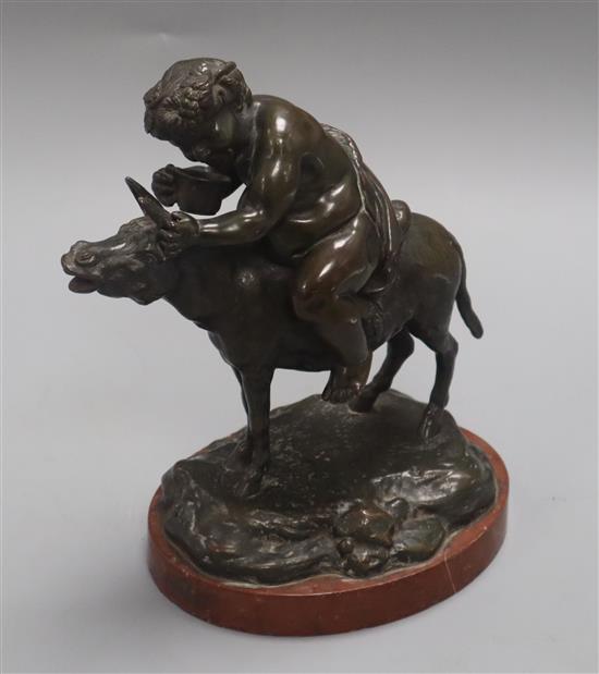 A 19th century bronze of Bacchus riding a donkey, rouge marble base H.22cm